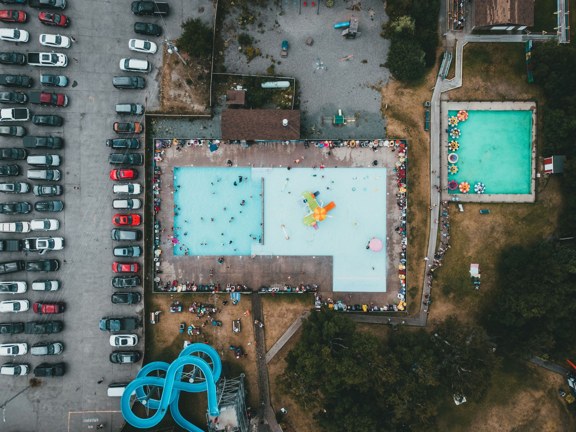 Aerial view of an amusement park with a pool